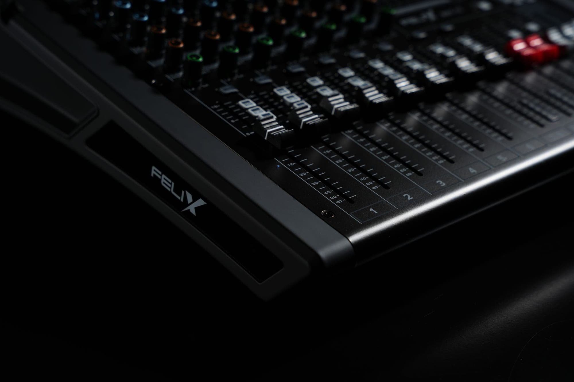 Faders of an audio mixer in low light